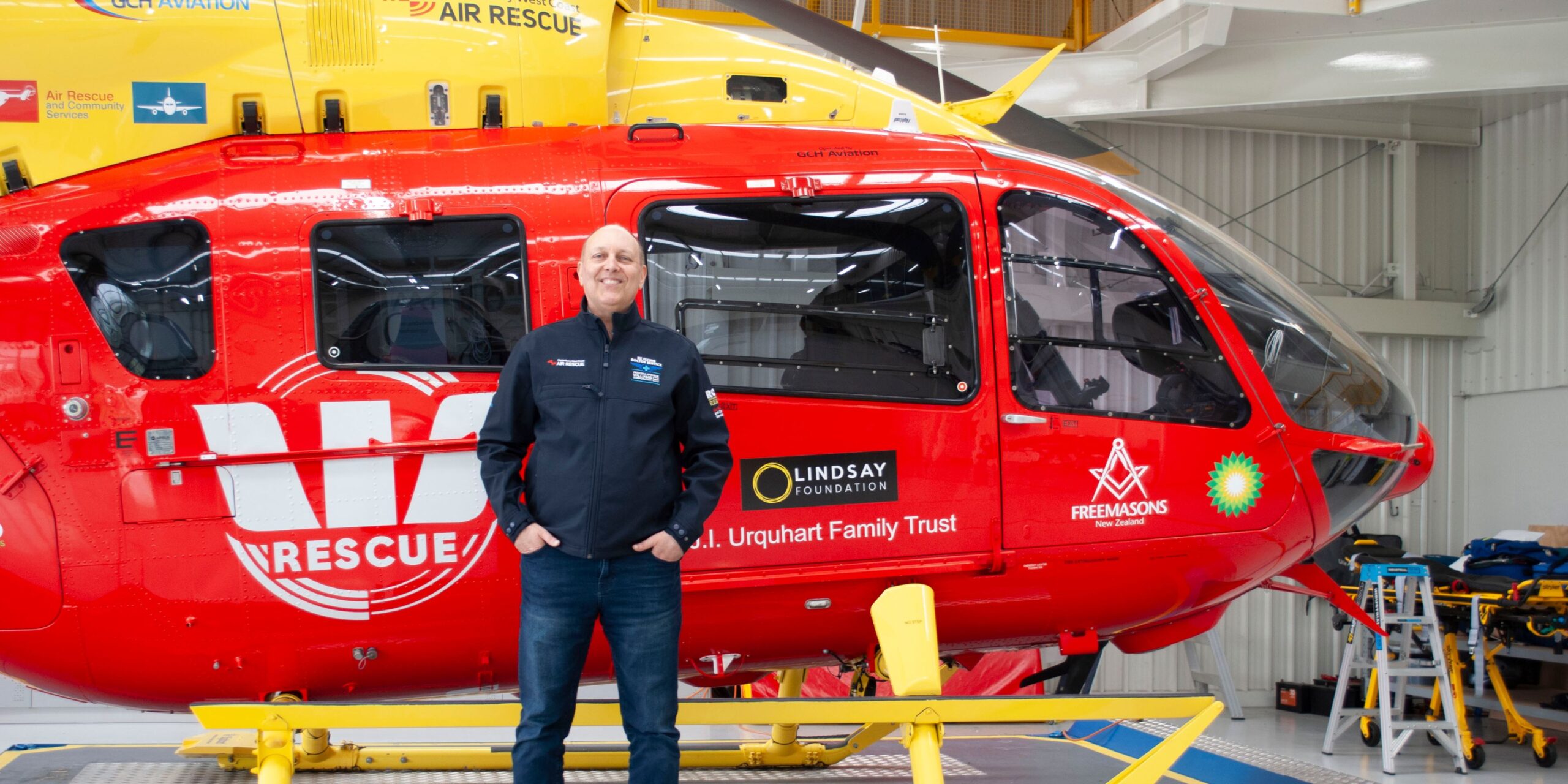 Sean in front of the rescue helicopter