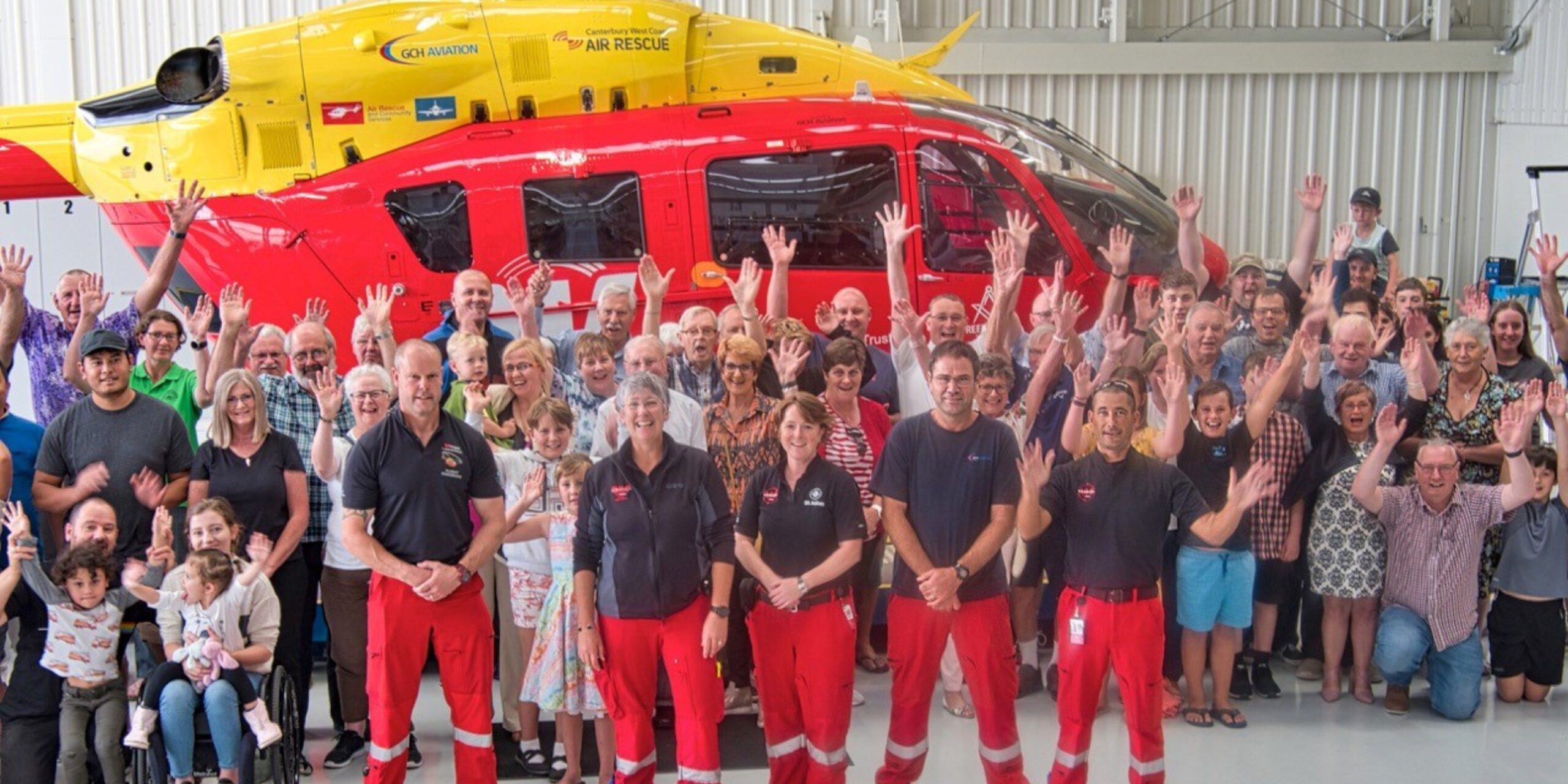 Freemasons group in front of the rescue helicopter