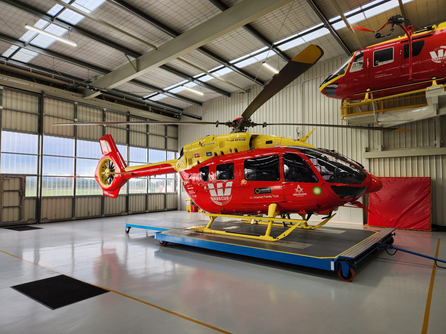 H145 in hangar with simulator in shot