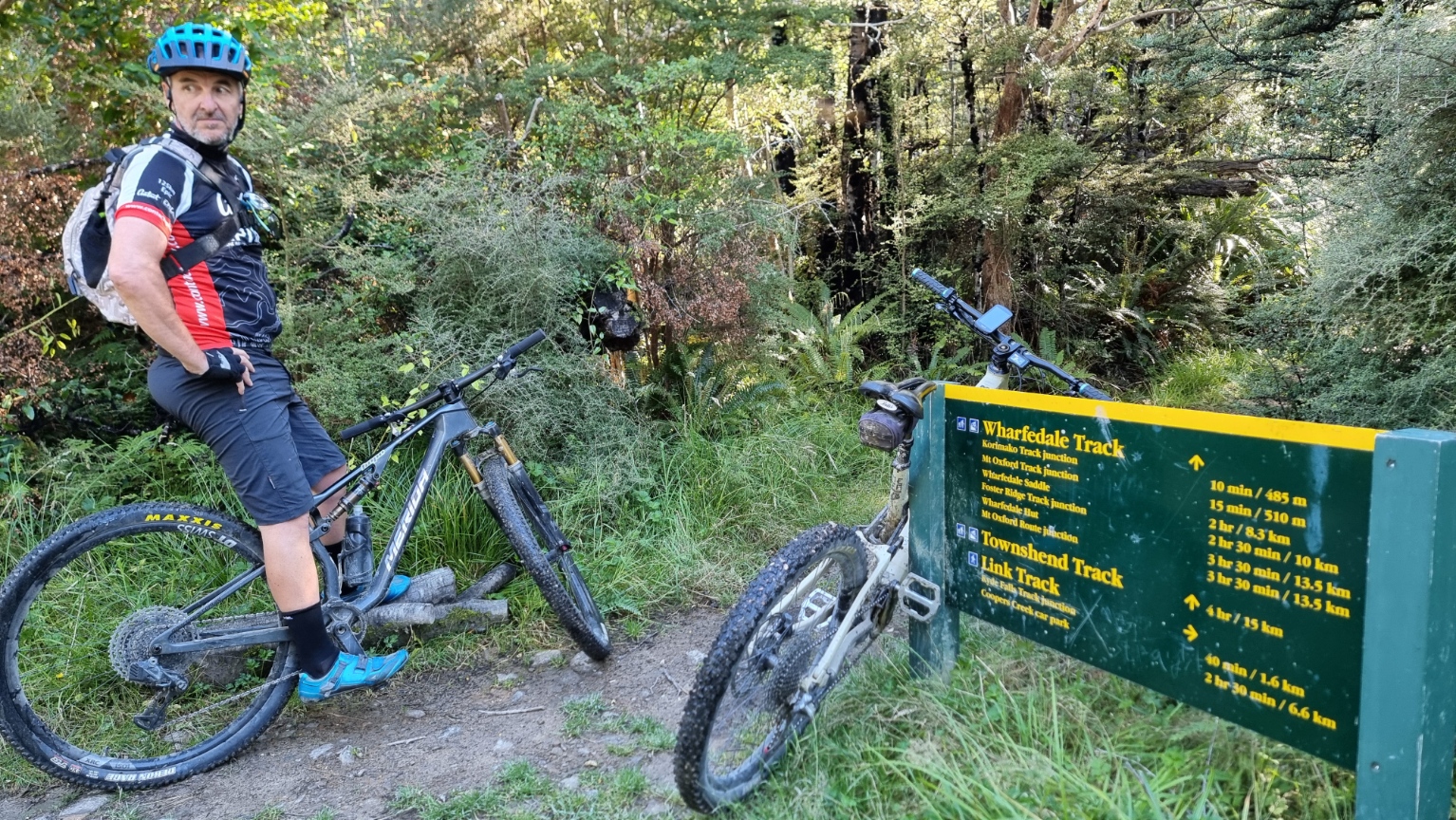 on the trail by the distance sign