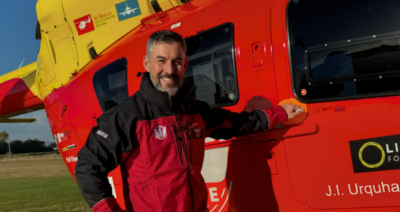 Edward Fry with an H145 rescue helicopter