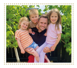 A rescue paramedic holding his three children.