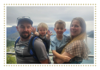 mum and dad holding their 2 young boys