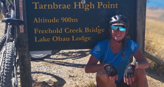 An image of Michelle Donnell next to a biking track